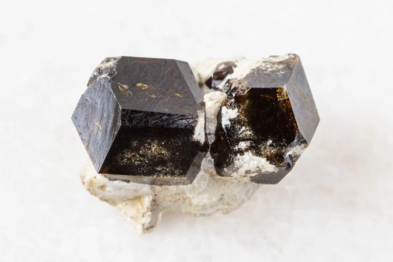 Raw Andradite Garnet Mineral Showing Natural Rough Crystal Structure With Brown Tones