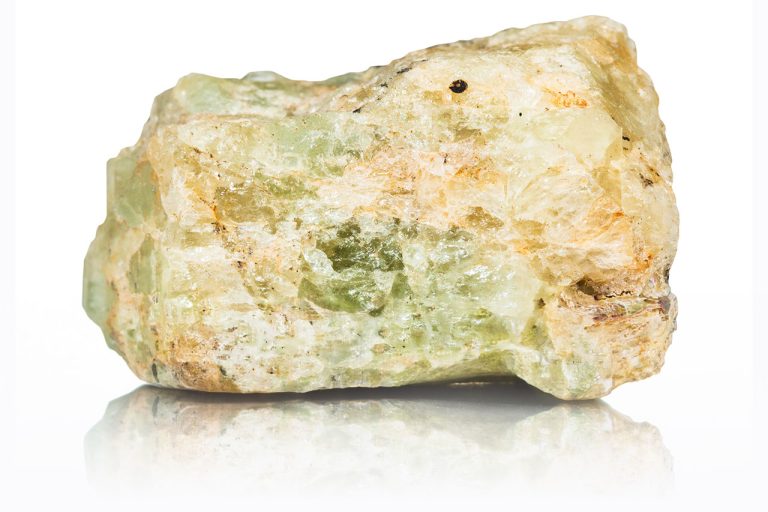Raw chrysoberyl crystal with natural rough texture and yellow-green prismatic crystals