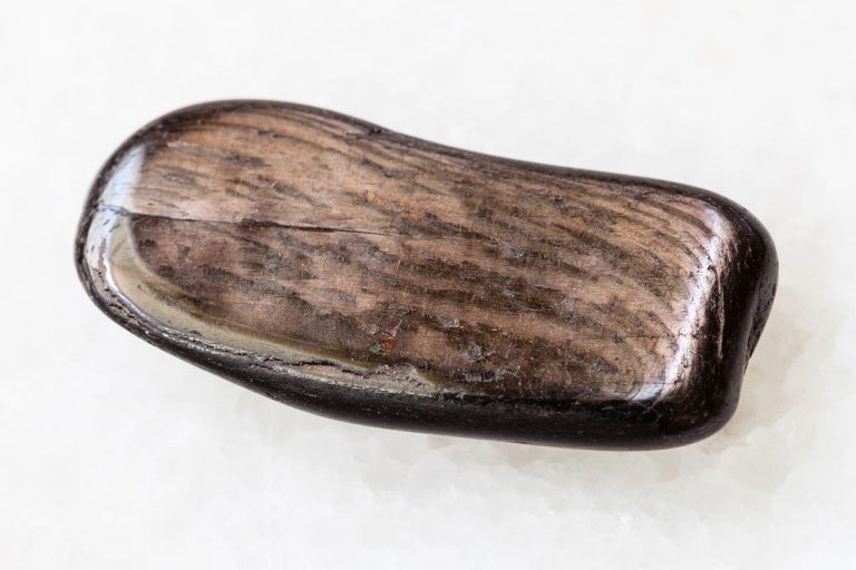 Tumbled Hypersthene Crystal With Polished Dark Gray Surface And Metallic Sheen