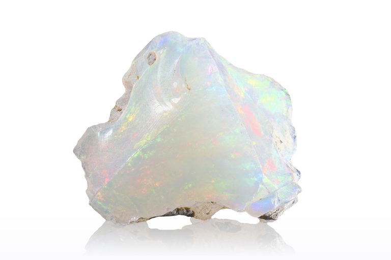 Raw opal stone with a rough natural surface and flashes of iridescent color.