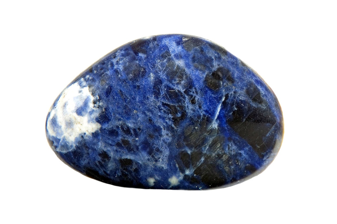 Polished sodalite stone with smooth glossy finish, deep blue color and flowing white veins throughout.