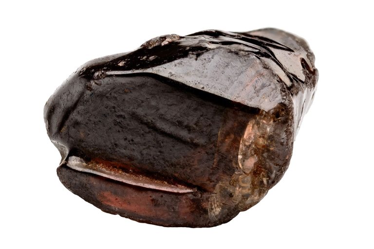 Raw Zircon Mineral Showing Natural Rough Crystal Structure And Earthy Colors